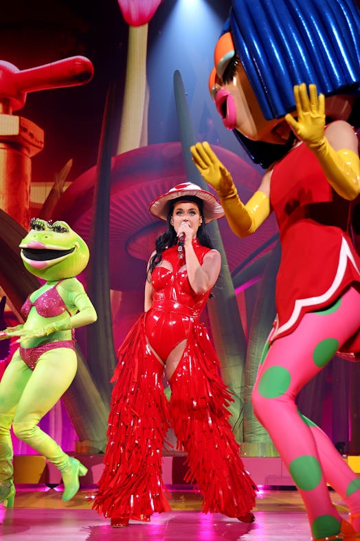katy perry performs in vegas wearing red fringe pants and a mushroom cap