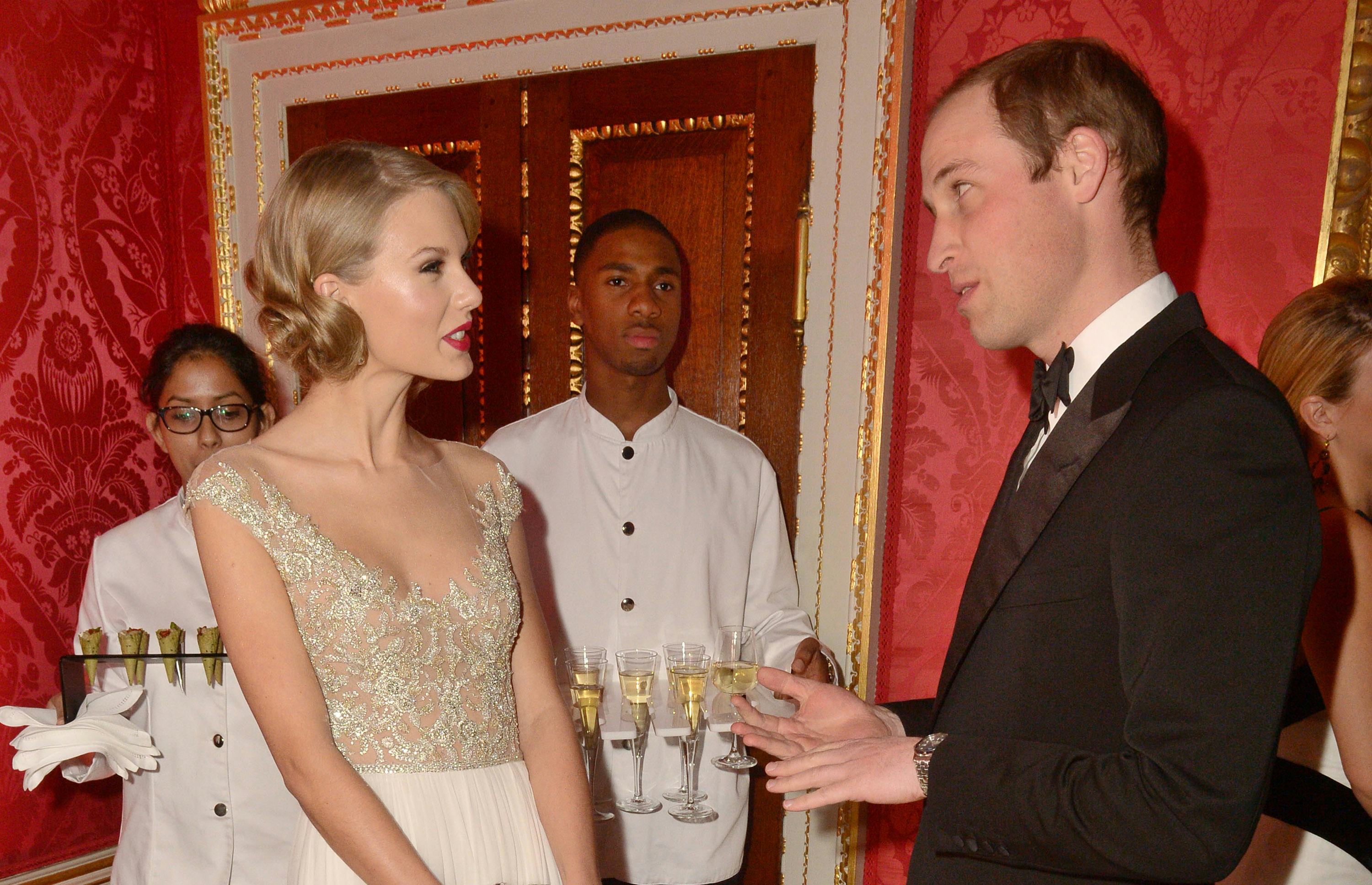 Prince William, Duke of Cambridge meets singer Taylor Swift at Kensington Palace.