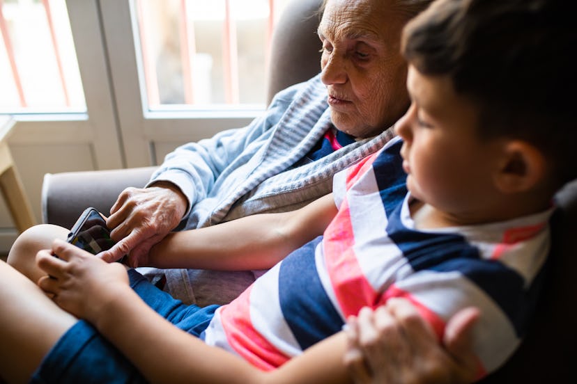 A young boy is helping his great grandmother learn how to use a smartphone, in a story answering the...
