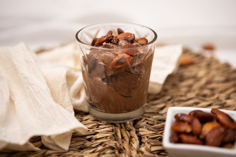 Delicious chocolate mousse dessert with caramelized almonds served in a glass cup - Argentine cultur...