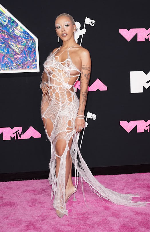 Doja Cat joined the "naked clothing trend" at the 2023 MTV Music Video Awards with a barely-there Mo...