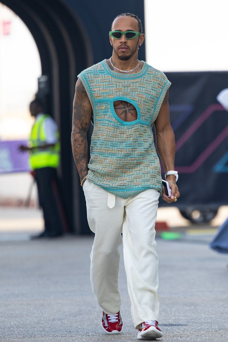 LUSAIL, QATAR - OCTOBER 8: Lewis Hamilton of Great Britain and Mercedes AMG walks in the paddock dur...
