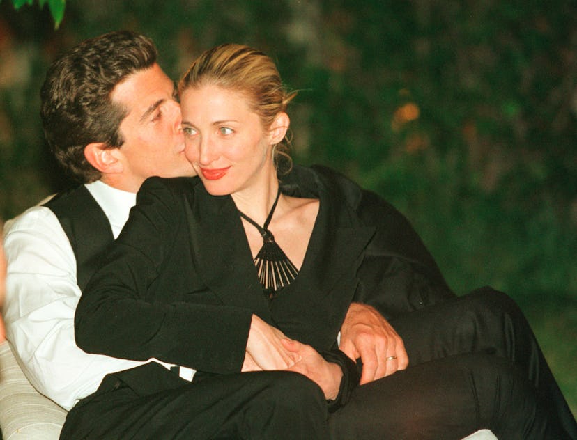 359625 01: (MAGS PLEASE CALL) John F. Kennedy, Jr. editor of George magazine, gives his wife Carolyn...