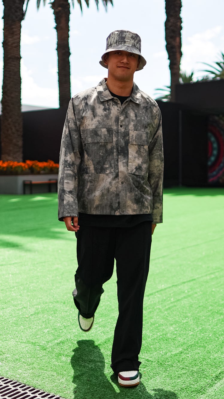 MEXICO CITY, MEXICO - OCTOBER 26: Zhou Guanyu of China and Alfa Romeo F1 walks in the Paddock during...