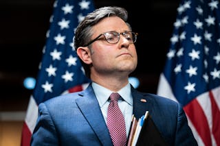 Speaker of the House Mike Johnson, R-La., listens during a press conference on Capitol Hill on Thurs...