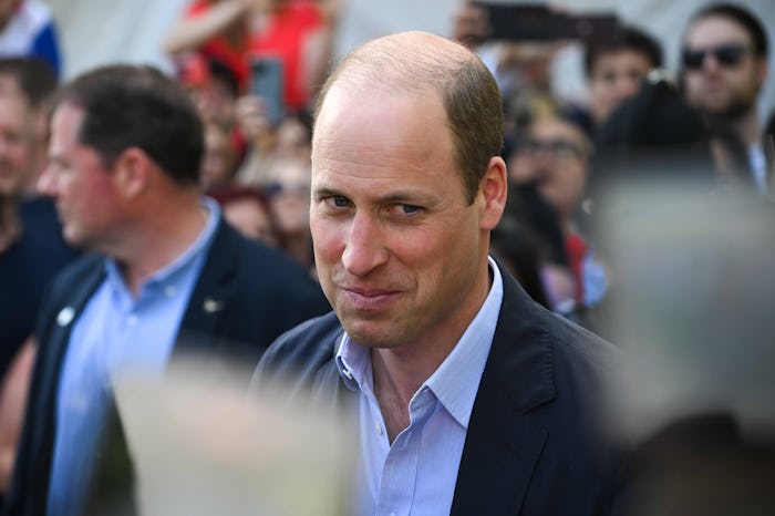WINDSOR, ENGLAND - MAY 07: Prince William, Prince of Wales speaks to people during a walkabout at Th...