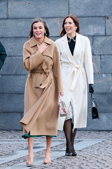 Queen Letizia of Spain (L) and Crown Princess Mary of Denmark (R) attend a wreath laying ceremony at...