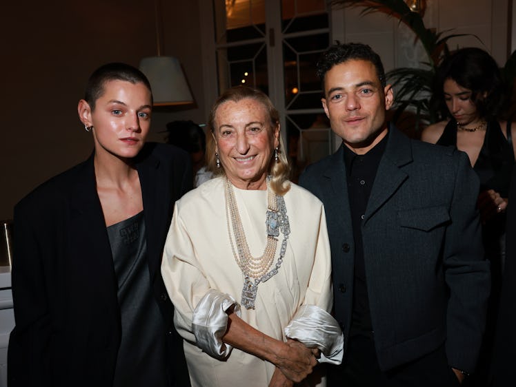 Emma Corrin, Miuccia Prada, and Rami Malek attend the Miu Miu Dinner Party at Laurent as part of the...