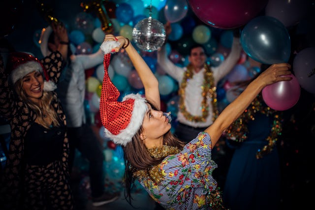 Group of friends having a new year party and dancing