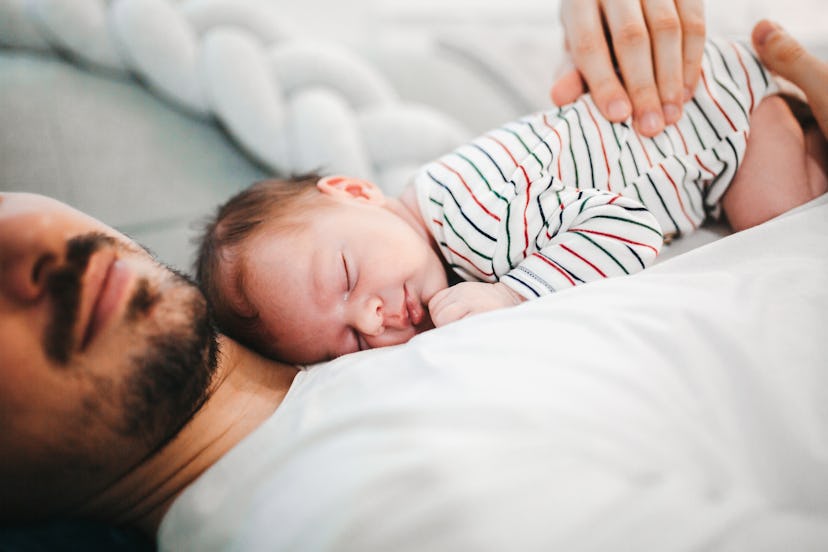Father and baby son sleeping on his chest, in a story answering the question, why do babies do the n...