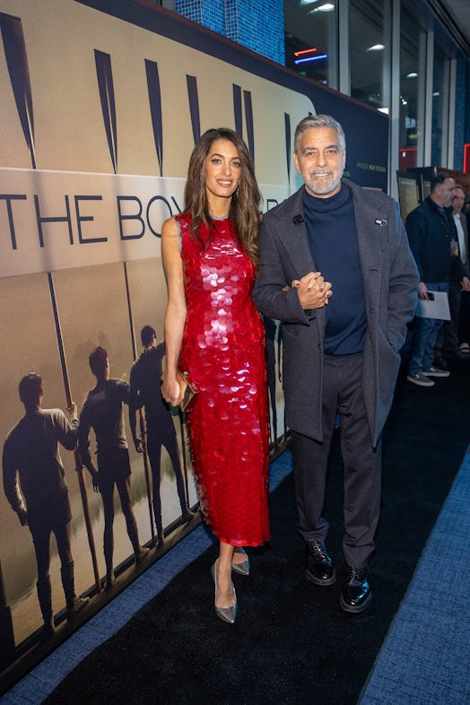Amal Clooney (L) and George Clooney attend the MGM Seattle community screening of "The Boys In The B...