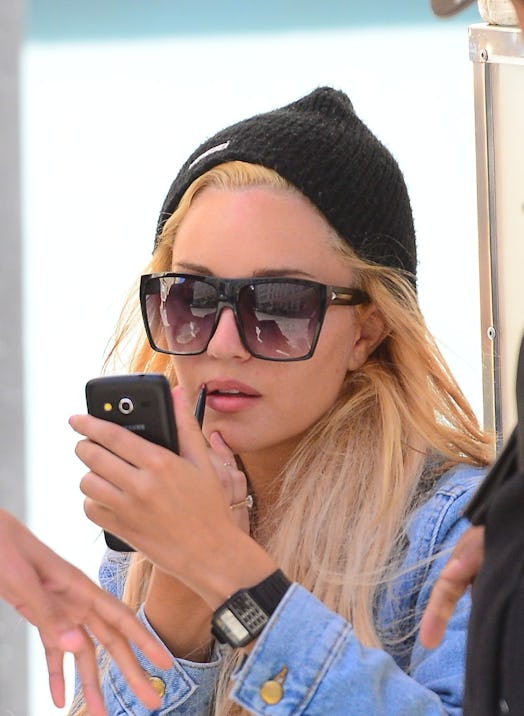 Amanda Bynes spoke about her face tattoo on the premiere episode of her podcast.