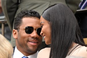 LONDON, ENGLAND - JUNE 30:  Russell Wilson and Ciara smile at each other as they attend Day Four of ...