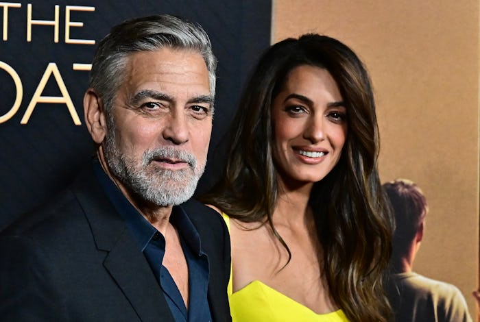 George Clooney has convinced his twins he talks to Santa.