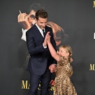 Bradley Cooper and Lea De Seine Shayk Cooper high-five while attending Netflix's "Maestro" Los Angel...