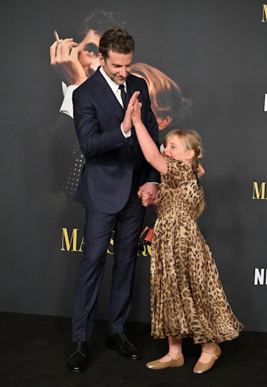 Bradley Cooper and Lea De Seine Shayk Cooper high-five while attending Netflix's "Maestro" Los Angel...