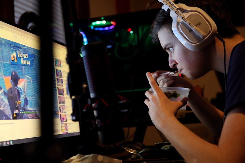 BOSTON, MA - MAY 30: Jordan Herzog, aka Crimz, watches a video during while taking a dinner break fr...