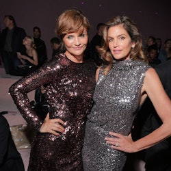 Helena Christensen and Cindy Crawford in the front row (Photo by Swan Gallet/WWD/Penske Media via Ge...