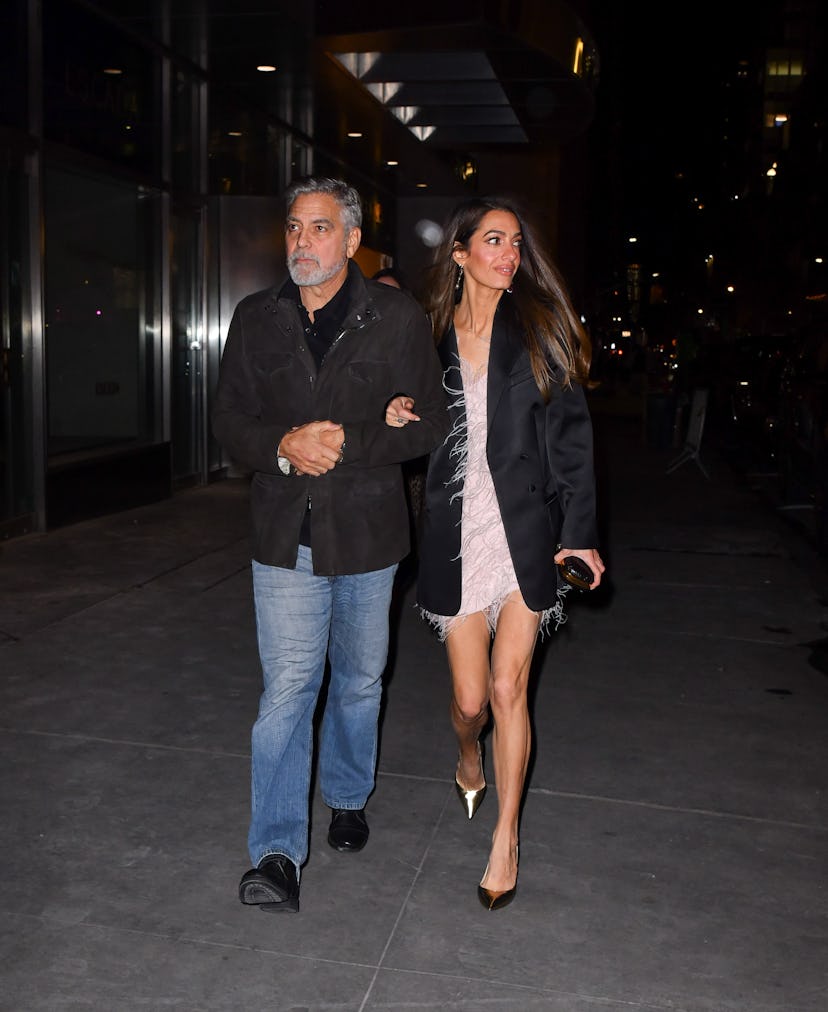 George Clooney and Amal Clooney arrive to the Polo Bar on December 13, 2023 in New York City.
