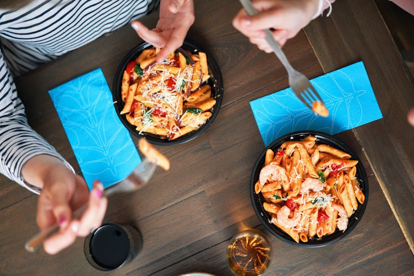 Family Enjoying various delivery bowls like Pesto Cavatappi Bowl, Spaghetti and Meatballs Bowl, Past...