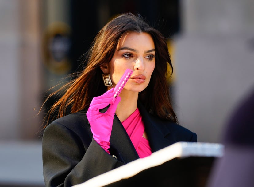 Emily Ratajkowski wore a hot pink, cut-out catsuit while filming a commercial for Maybelline New Yor...