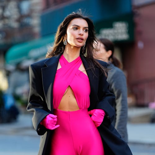 Emily Ratajkowski wore a hot pink, cut-out catsuit while filming a Maybelline commercial