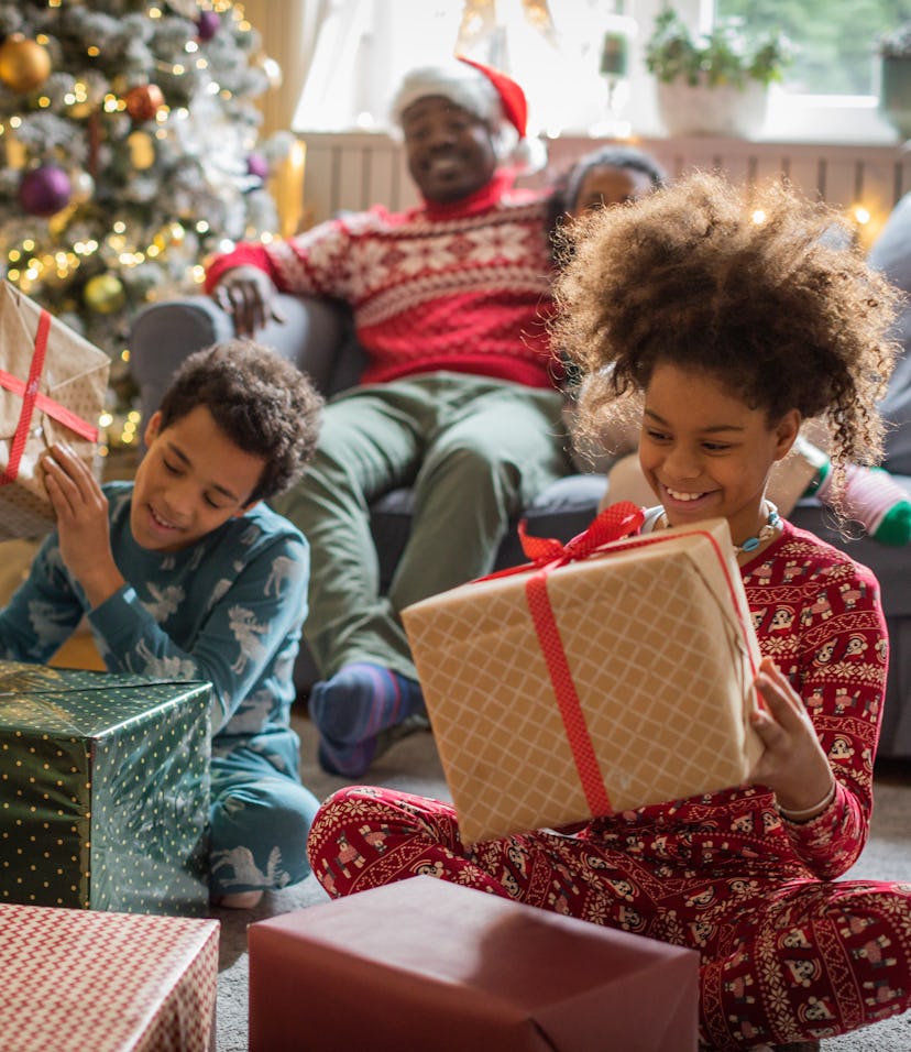 Family at home for Christmas opening gifts. These are the gifts parenting editors are excited to buy...