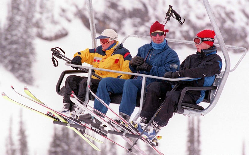 The Prince of Wales (centre) with son's William (right) and Harry on the ski lift at Whistler, in Ca...