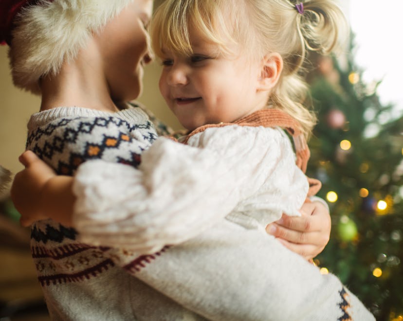 Happy children on Christmas Eve at home