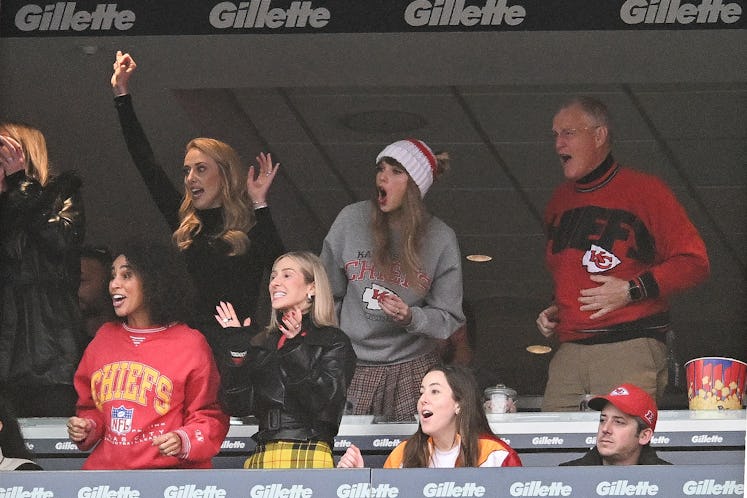 Taylor Swift and her dad, Scott Swift, cheer on the Kansas City Chiefs versus the New England Patrio...