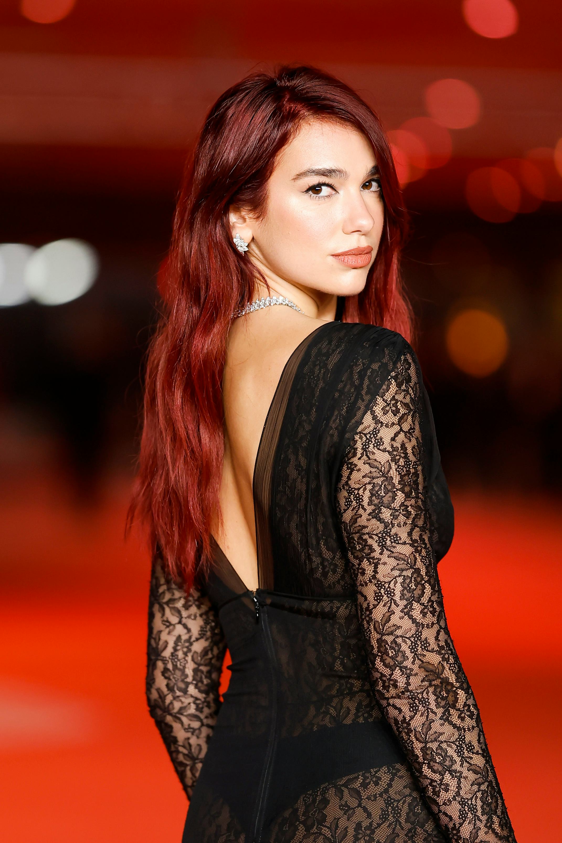 Dua Lipa&rsquo;s &ldquo;cherry coke&rdquo; brunette is a popular winter hair color trend for 2024.