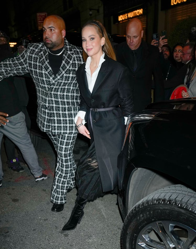Jennifer Lawrence attends the Saks/Christian Dior holiday display unveiling at Saks Fifth Avenue Fla...