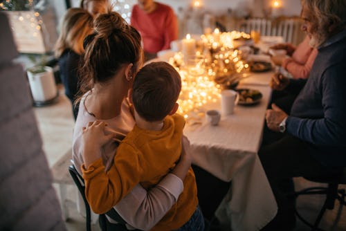 Photo of a multi-generation family during Christmas dinner, unsolicited comments from in-laws or rel...