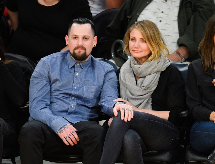 Benji Madden (L) and Cameron Diaz attend a basketball game between the Washington Wizards and the Lo...