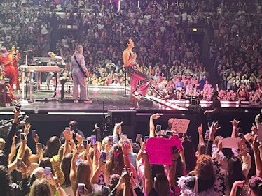 Harry Styles performing on stage for fans on his 'Love On Tour.'
