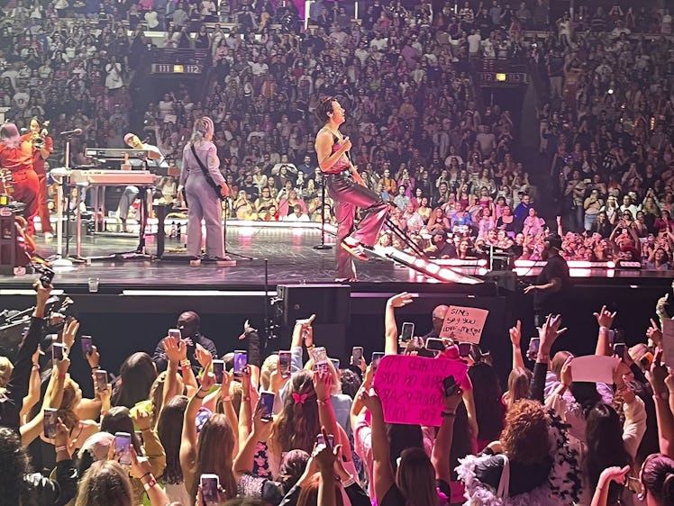 Harry Styles performing on stage for fans on his 'Love On Tour.'