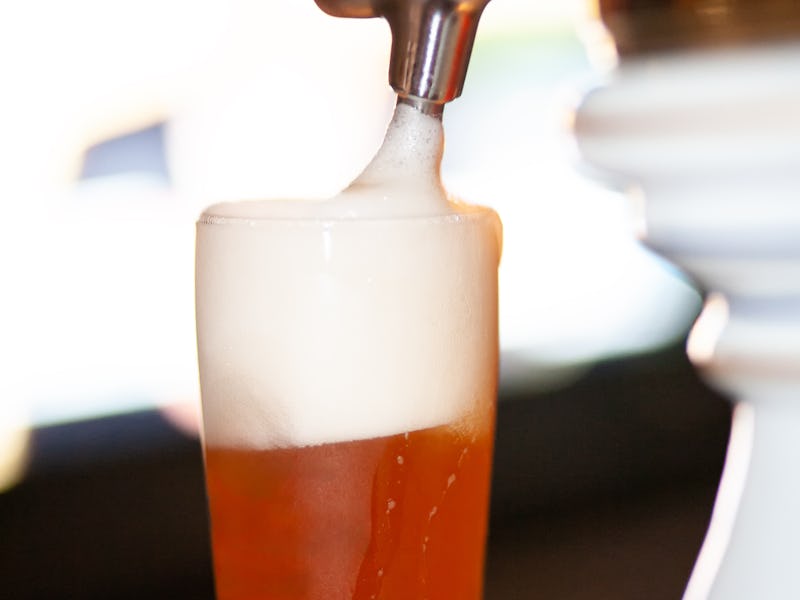 Effervescent Moments: Enjoy the Crispness of Cold Beer Bubbles in a Golden Glass - Unwind with Every...