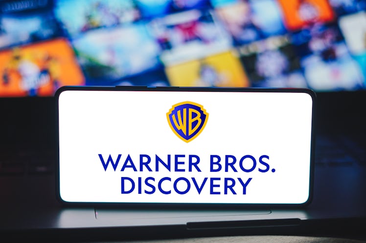 BRAZIL - 2023/12/16: In this photo illustration, the Warner Bros. Discovery logo is displayed on a s...
