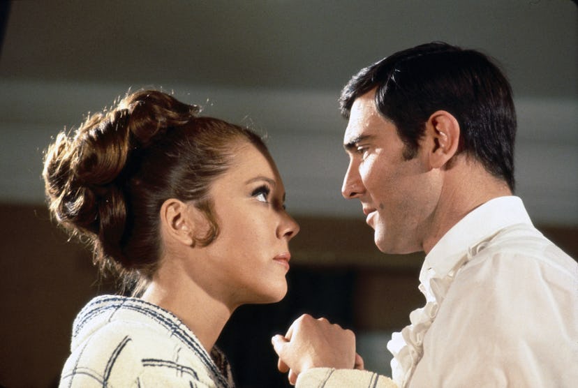 British actress Diana Rigg and Australian actor George Lazenby on the set of On Her Majesty's Secret...