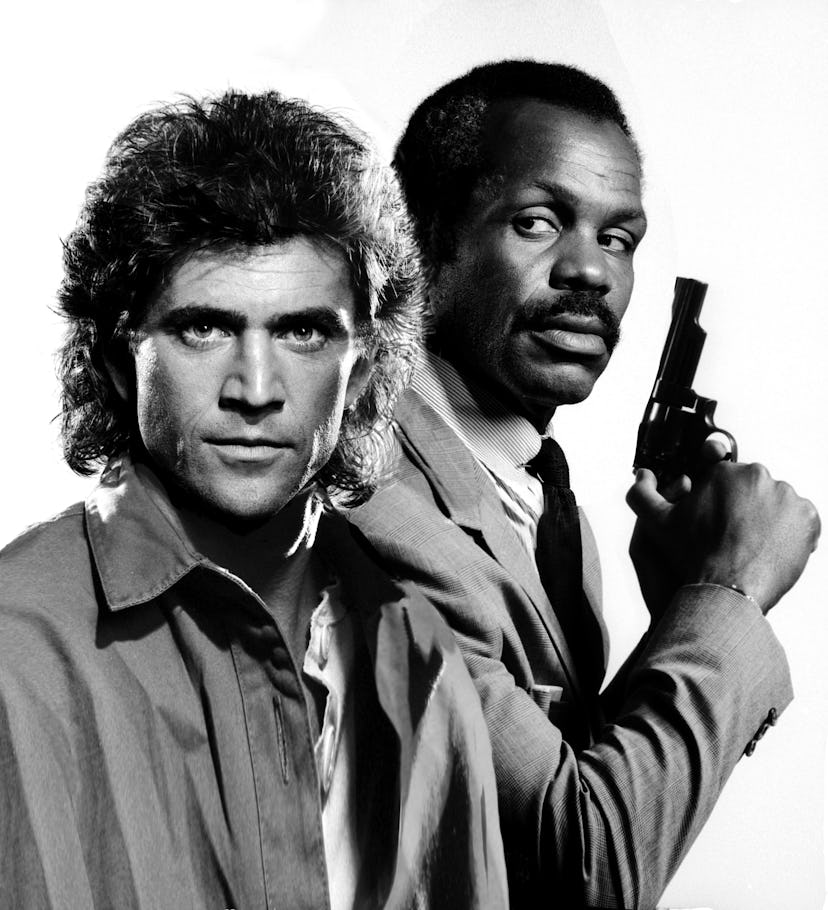 Los Angeles - CIRCA 1987: Mel Gibson and Danny Glover pose for the Lethal Weapon " movie poster in L...