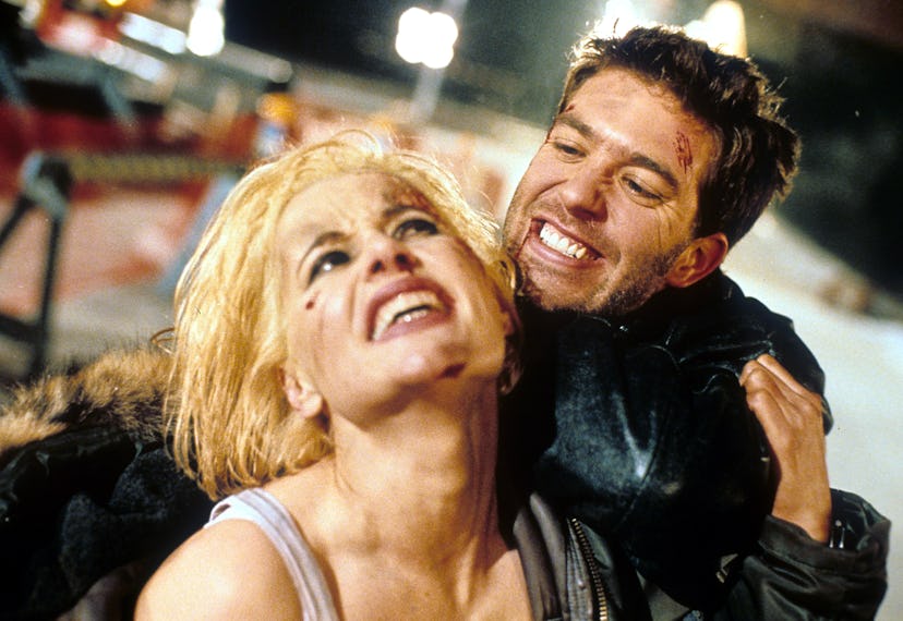 Geena Davis struggling to pull away from Craig Bierko, who has a grab on her in a scene from the fil...