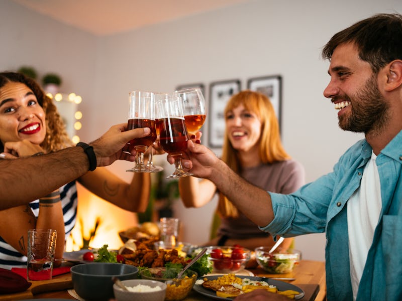 Friends and family gathered around dinner table