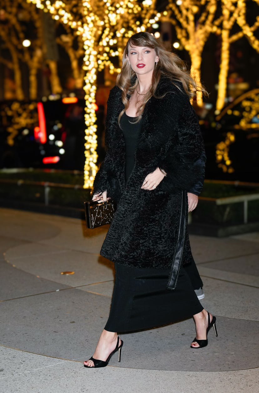 Taylor Swift wears a black fur coat while attending the premiere of "Poor Things" in New York