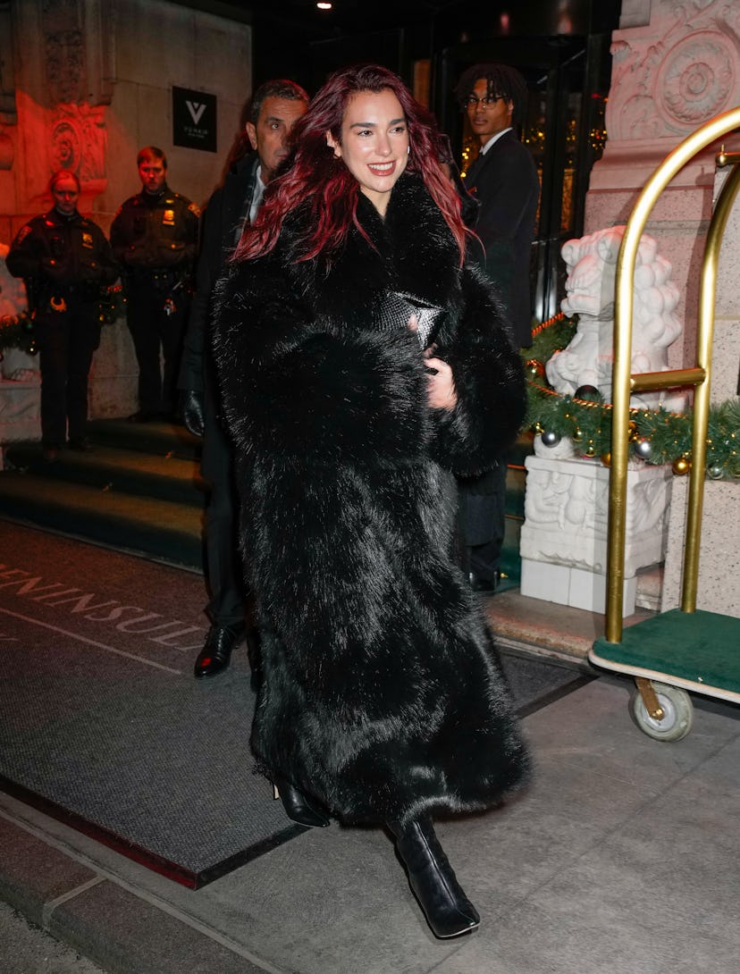 Dua Lipa wears a black fur coat from Entire Studios for a special screening of "Barbie" in New York