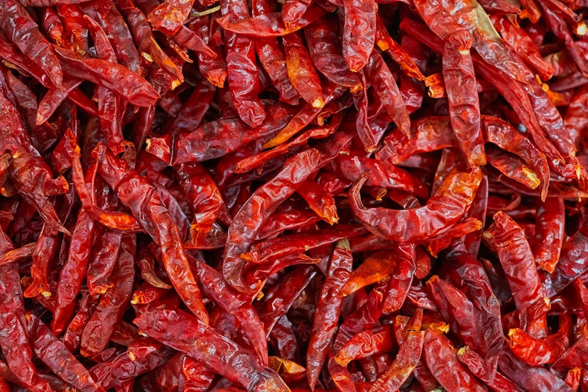 Close up and high angle view of dried red hot chili peppers for sale in the market in Izmir.