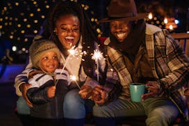 Playing with sparkles, the family is enjoying themselves