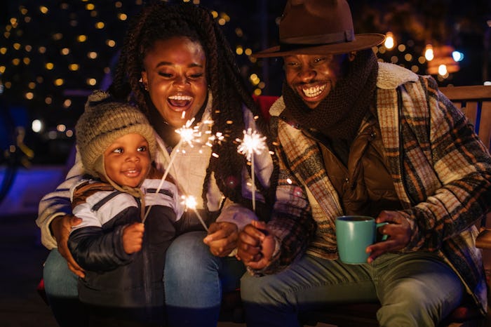 Playing with sparkles, the family is enjoying themselves