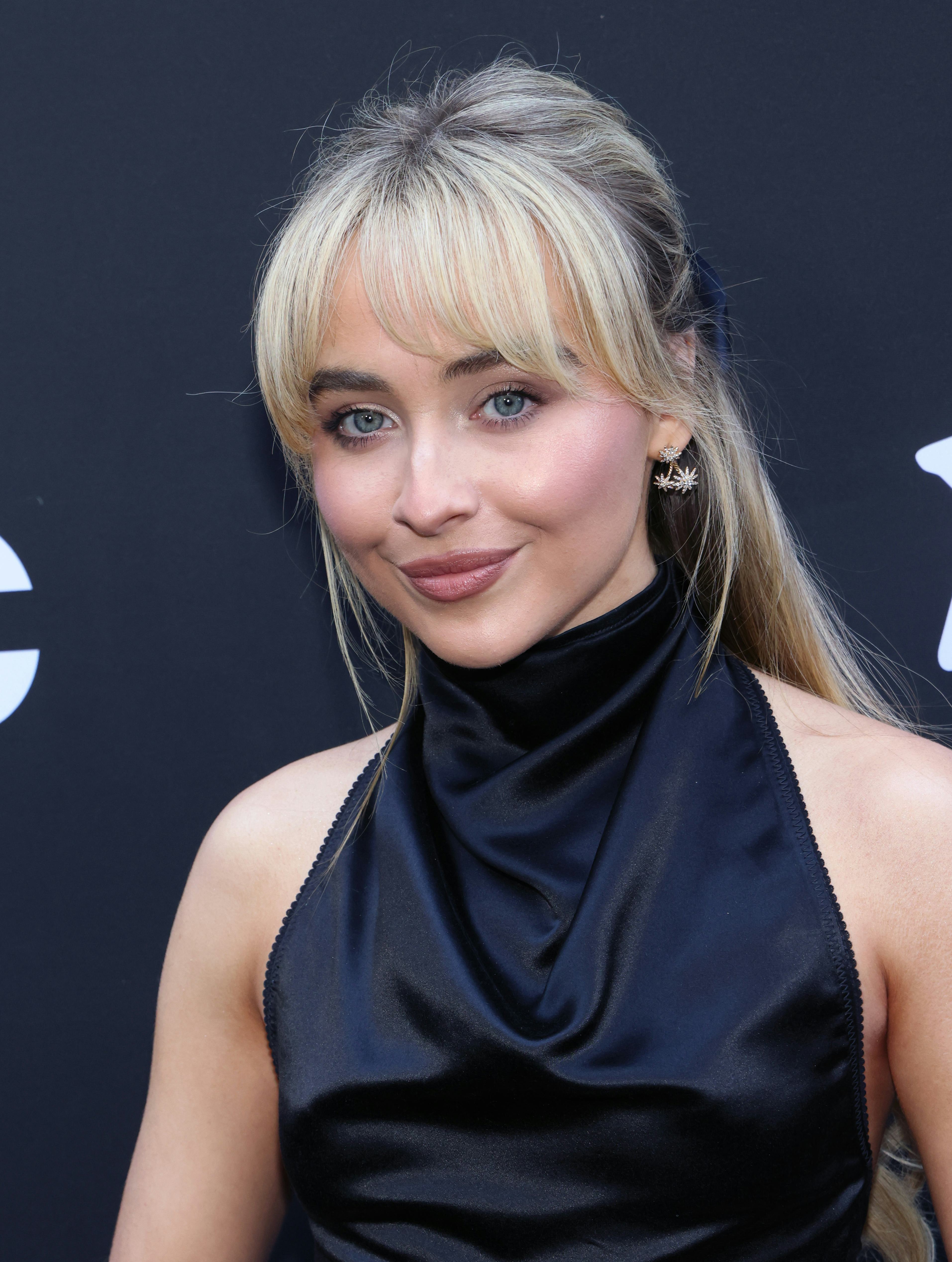 Sabrina Carpenter with light vanilla-colored hair.