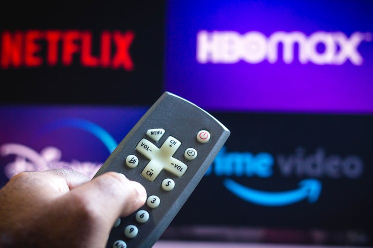 BRAZIL - 2021/06/03: In this photo illustration a close-up of a hand holding a TV remote control see...