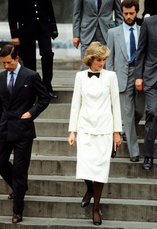 Prince Charles, Prince of Wales and Diana, Princess of Wales, wearing a white tuxedo suit with a bow...